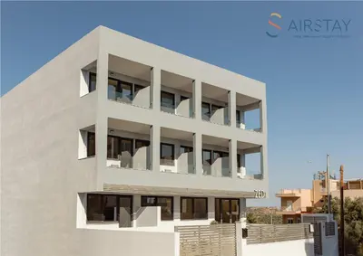 an apartment building with balconies on the side of it at Zed Smart Property Airport by Airstay in Spáta