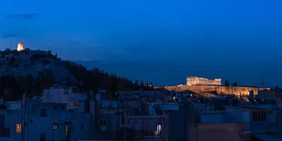 a view of a city at night with the acropolis at TopFloor Getaway Balcony&Hot tub+Acropolis view in Athens