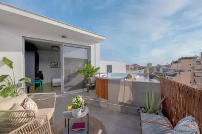 an apartment balcony with a view of a city at TopFloor Getaway Balcony&Hot tub+Acropolis view in Athens