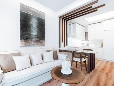 a living room with a white couch and a table at Luxury Apartment in the Heart of the City - 1BR in Athens