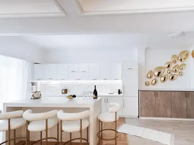 a kitchen with white cabinets and bar stools at Luxury 3BR Apartment in the Heart of the City in Athens