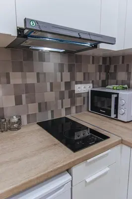 a kitchen with a stove and a microwave at Niovis Loft VIPGreece in Athens