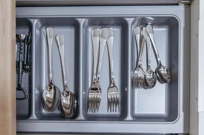 a bunch of spoons and forks in a sink at Niovis Loft VIPGreece in Athens