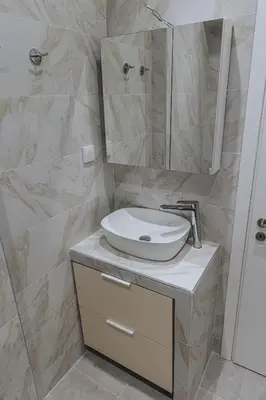 a bathroom with a sink and a mirror at Niovis Loft VIPGreece in Athens