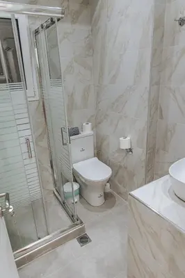 a bathroom with a toilet and a shower and a sink at Niovis Loft VIPGreece in Athens