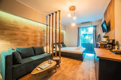 a living room with a couch and a table at Nueva Era Boutique in Athens