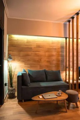 a living room with a couch and a table at Nueva Era Boutique in Athens