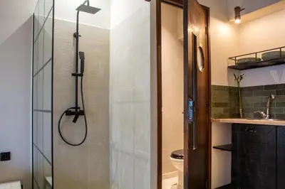 a bathroom with a shower and a sink at Mosaics studio apt in the Central Market of Athens in Athens