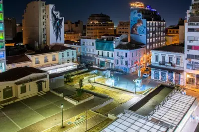 a view of a city at night at Mosaics studio apt in the Central Market of Athens in Athens