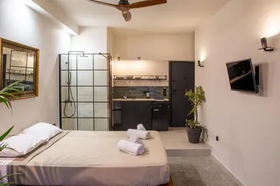 a bedroom with two towels on a bed at Mosaics studio apt in the Central Market of Athens in Athens