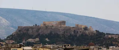 a view of a mountain with a city on it at Spacious Modern Apartments With Great Rooftop View in Athens