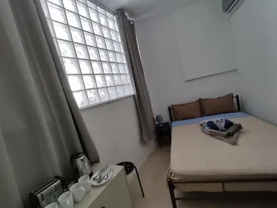 a small room with a bed and a window at PURE URBAN METRO KATO PATISIA in Athens
