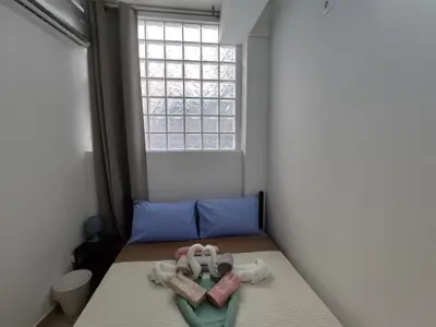 a small room with a bed and a window at PURE URBAN METRO KATO PATISIA in Athens
