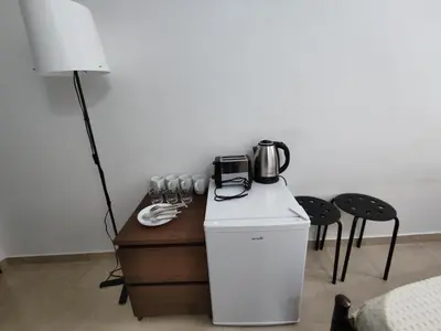 a room with a table with a coffee maker on it at PURE URBAN METRO KATO PATISIA in Athens