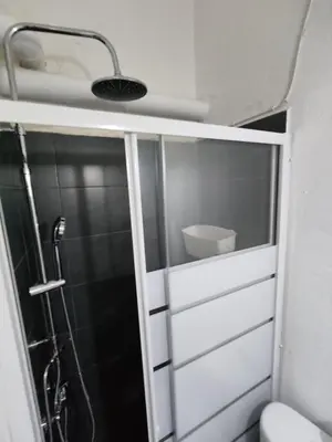 a bathroom with a shower and a toilet and a sink at PURE URBAN METRO KATO PATISIA in Athens