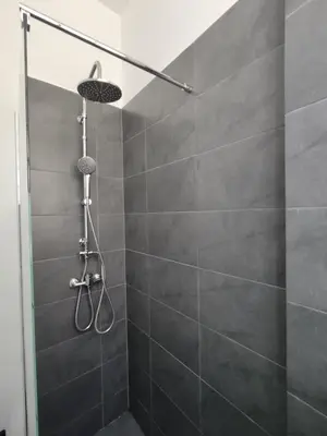 a shower with a shower head in a bathroom at PURE URBAN METRO KATO PATISIA in Athens