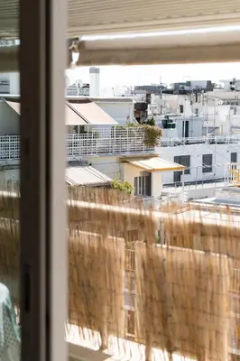 a view of a city from a window at Lycabetus View Loft Downtown Kolonaki in Athens