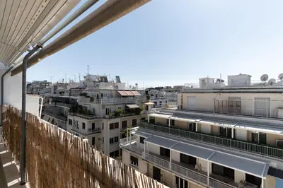 a view of a city with tall buildings at Lycabetus View Loft Downtown Kolonaki in Athens