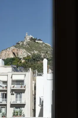 a view of a mountain from a building at Lycabetus View Loft Downtown Kolonaki in Athens