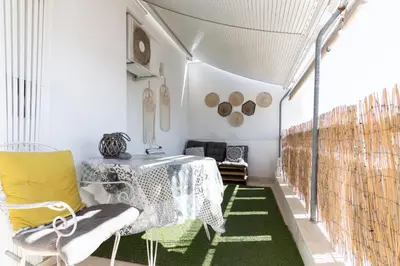 a dining room with a table and a green rug at Lycabetus View Loft Downtown Kolonaki in Athens
