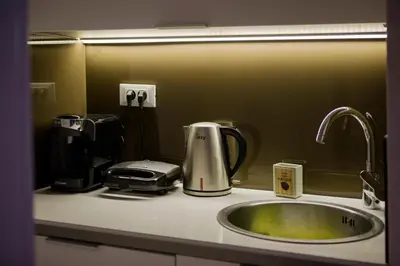 a kitchen sink with a toaster and a toaster at Athens Riviera Bay View Suite By The Olon in Athens
