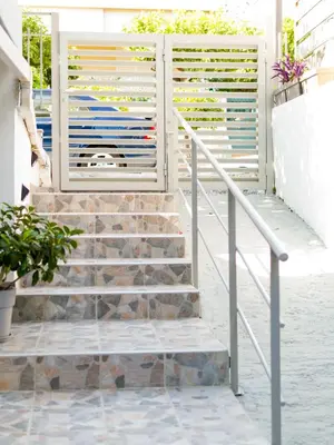 a set of stairs leading up to a building at Easy & Comfy Nights in Athens