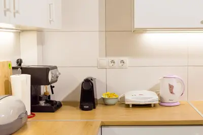 a kitchen with a counter top with appliances on it at Easy & Comfy Nights in Athens