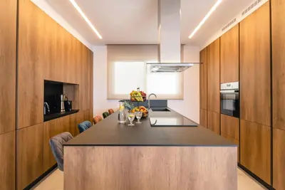 a kitchen with a large island in a room at Divine Residence, a SeaView Retreat, By ThinkVilla in Piraeus