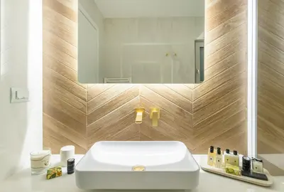 a bathroom with a white sink and a mirror at Divine Residence, a SeaView Retreat, By ThinkVilla in Piraeus