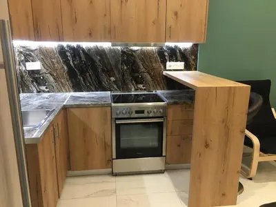 a kitchen with a counter with a stove and a sink at LUXURY IPOGA in Athens