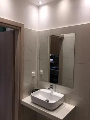 a bathroom with a sink and a mirror at LUXURY IPOGA in Athens