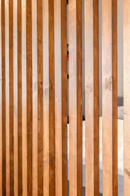 a close up of a wooden bench with wood panels at Industrial Rental Loft in Athens