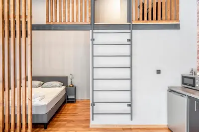 a bedroom with a bed and a bunk bed at Industrial Rental Loft in Athens
