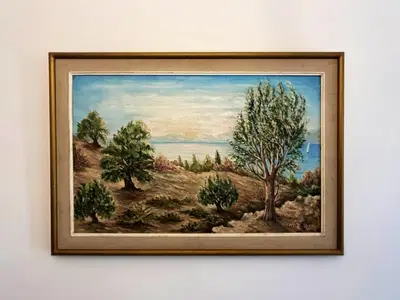 a framed painting of a field with trees at Apollonion Luxury Apartment near the metro station in Athens