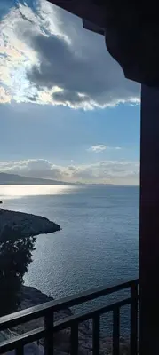a view of the ocean from a balcony at Blue Seaview Suites in Piraeus