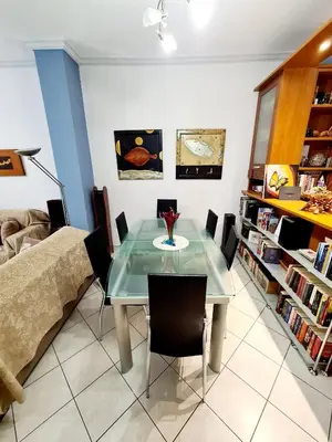 a dining room with a glass table and chairs at Large terrace apartment near city centre in Athens