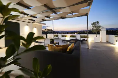 a living room with a couch on a patio at Ma Maison No7 Acropolis View Mansion, Roof Garden in Athens
