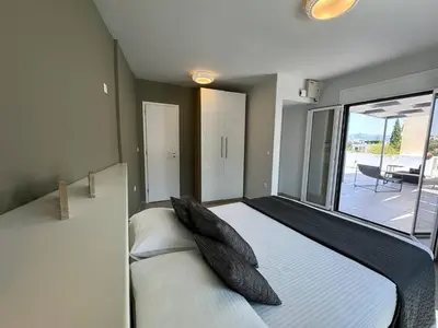 a bedroom with two beds and a large window at Ma Maison No7 Acropolis View Mansion, Roof Garden in Athens