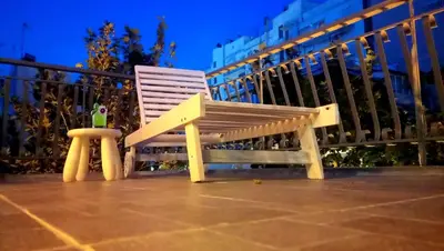a wooden bench sitting on top of a balcony at Skyhi Athens Penthouse ! in Athens