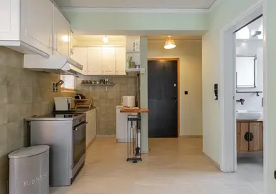 a kitchen with a sink and a stove top oven at Skyhi Athens Penthouse ! in Athens