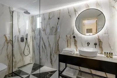 a bathroom with a sink and a mirror at Meno Suite with Private Terrace - Jaccuzzi, Acropolis View in Athens