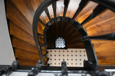 an overhead view of a spiral staircase with a window at Neapolis 1897 Boutique Luxury Rooms in Athens