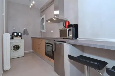 a kitchen with a sink and a stove top oven at Studio in the heart of Athens, next to Metro &... in Athens