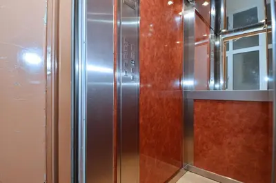 a stainless steel refrigerator in a kitchen at Studio in the heart of Athens, next to Metro &... in Athens