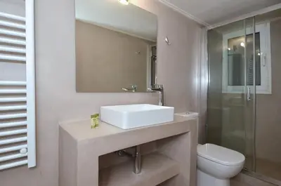 a bathroom with a sink and a toilet and a mirror at Studio in the heart of Athens, next to Metro &... in Athens