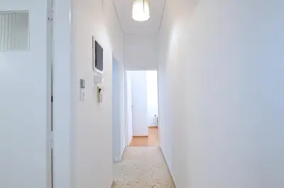 a hallway in a house with white walls and a ceiling at A cozy minimal apartment at Koukaki, Dimitrako... in Athens