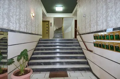 a stairway in a building with a bunch of stairs at A minimal retire at Kypseli with an amazing view in Athens