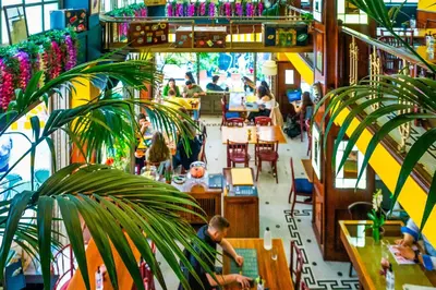 an overhead view of a restaurant with people sitting at tables at The Artisan Suites in Athens
