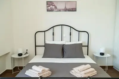 a bedroom with a bed with towels on it at Blue Dreams - Spectacular Sea View Apartment in Athens in Athens