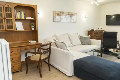a living room with a couch and a desk at Blue Dreams - Spectacular Sea View Apartment in Athens in Athens